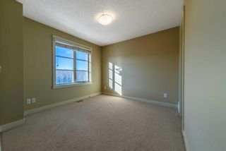 Photo 19: 1574 93 Street SW in Calgary: Aspen Woods Row/Townhouse for sale : MLS®# A2101400