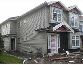 Photo 1: 452 E 44TH Avenue in Vancouver: Fraser VE 1/2 Duplex for sale (Vancouver East)  : MLS®# V681165