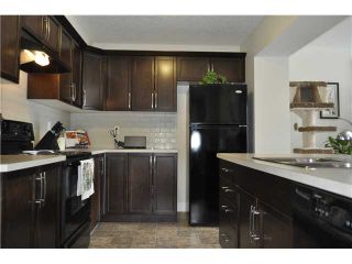 Photo 3: 118 WINDSTONE Crescent SW: Airdrie Townhouse for sale : MLS®# C3590682