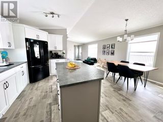 Photo 3: 147 Meadowplace Drive E in Brooks: House for sale : MLS®# A2030978