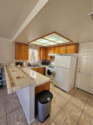 Photo 5: 1909 E 120th Street in Los Angeles: Residential for sale (C37 - Metropolitan South)  : MLS®# OC24029071