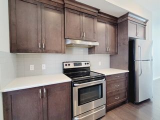 Photo 9: 106 Panatella Walk NW in Calgary: Panorama Hills Row/Townhouse for sale : MLS®# A1206869