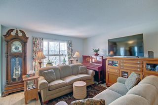 Photo 4: 212 Sunset Road: Cochrane Row/Townhouse for sale : MLS®# A1198532