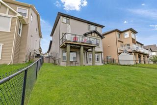 Photo 6: 100 Tremblant Way SW in Calgary: Springbank Hill Detached for sale : MLS®# A1230428