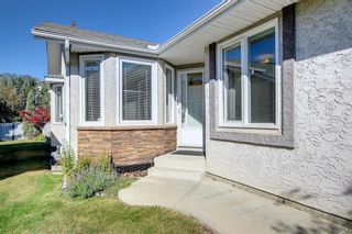 Photo 2: 297 Arbour Cliff Close NW in Calgary: Arbour Lake Semi Detached (Half Duplex) for sale : MLS®# A1255400