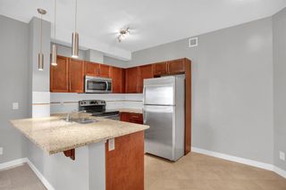 Photo 2: 2215 604 East Lake Boulevard NE: Airdrie Apartment for sale : MLS®# A2043886