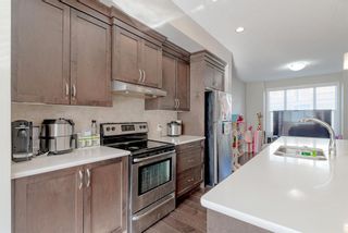 Photo 11: 107 Panatella Walk NW in Calgary: Panorama Hills Row/Townhouse for sale : MLS®# A1190534