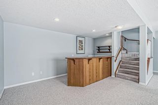 Photo 25: 8 220 Bow Ridge Court: Cochrane Semi Detached (Half Duplex) for sale : MLS®# A2026724