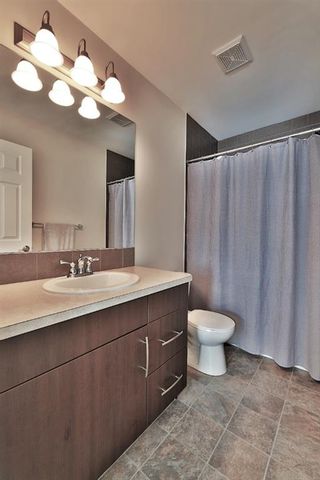 Photo 25: 104 Windstone Link SW: Airdrie Row/Townhouse for sale : MLS®# A1190179