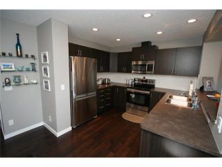 Photo 4: 225 SUNSET Common: Cochrane Residential Attached for sale : MLS®# C3590396