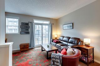 Photo 3: 450 Ascot Circle SW in Calgary: Aspen Woods Row/Townhouse for sale : MLS®# A1188870