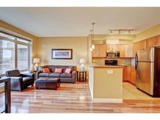 Photo 2: 1 169 Rockyledge View NW in Calgary: Rocky Ridge Row/Townhouse for sale : MLS®# A1241867