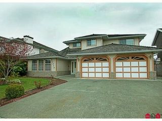 Photo 1: 12272 68 Avenue in Surrey: West Newton House for sale in "West Newton" : MLS®# F1402424