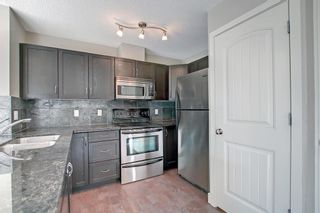 Photo 5: 10 301 Village Mews SW in Calgary: Patterson Apartment for sale : MLS®# A1246152