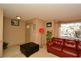 Photo 7: 202 ARBOUR MEADOWS Close NW in Calgary: Arbour Lake House for sale : MLS®# C4048885