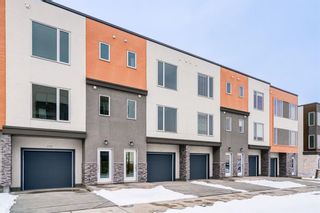 Main Photo: 410 Shawnee Square SW in Calgary: Shawnee Slopes Row/Townhouse for sale : MLS®# A2113214