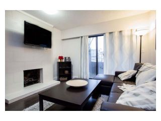 Photo 1: 102 2299 E 30TH Avenue in Vancouver: Collingwood VE Condo for sale in "TWIN COURT" (Vancouver East)  : MLS®# V1010933