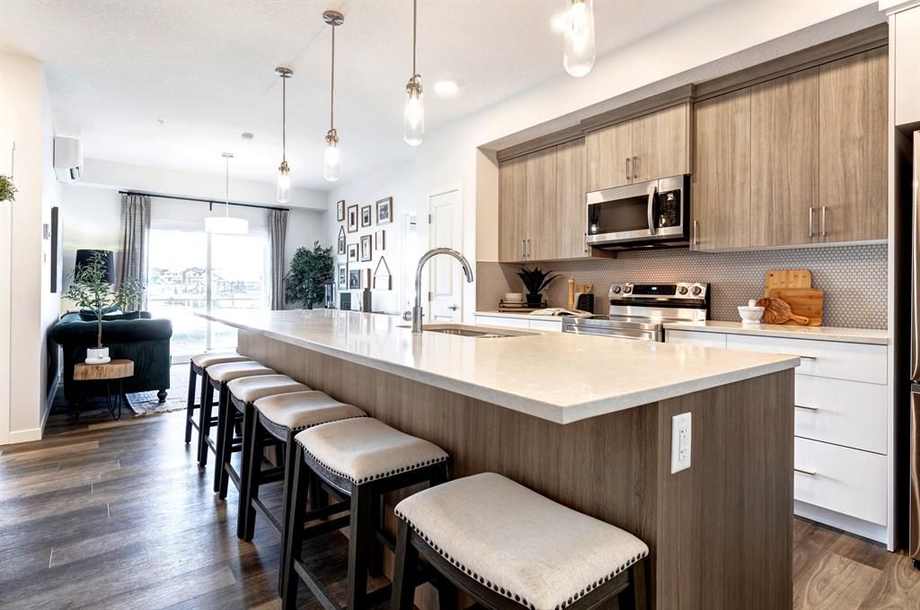 Main Photo: 106 80 Carrington Plaza NW in Calgary: Carrington Apartment for sale : MLS®# A2002313