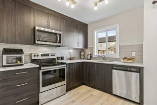 Photo 10: 116 31 Red Embers Parade in Calgary: Redstone Row/Townhouse for sale : MLS®# A2092992