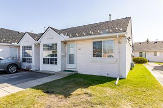 Photo 1: 14 209 Woodside Drive NW: Airdrie Row/Townhouse for sale : MLS®# A1211834