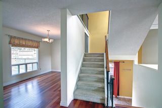 Photo 5: 130 Strathlorne Mews SW in Calgary: Strathcona Park Row/Townhouse for sale : MLS®# A1252004