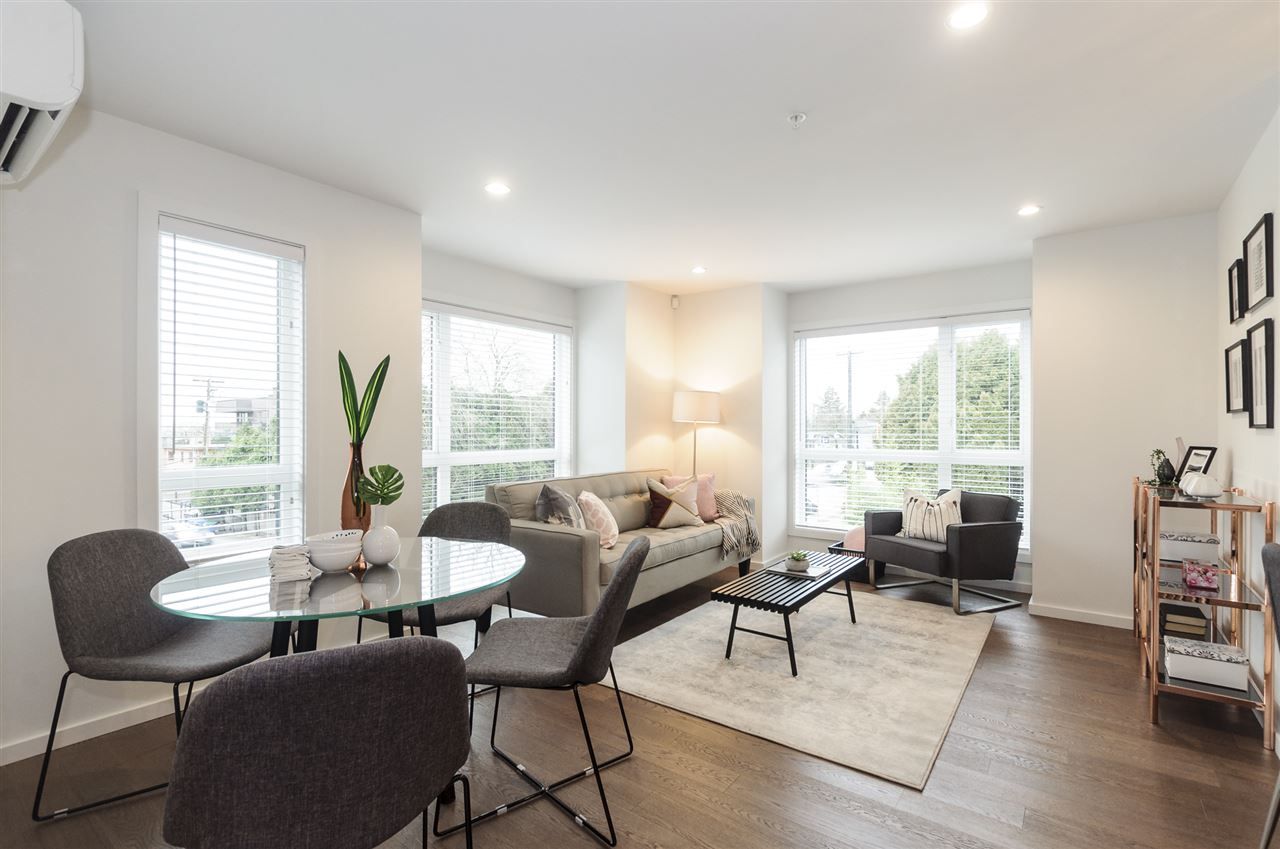 Bright corner end unit 2 storey quaint townhouse in Marpole, the Stunning Shaughnessy Gate-boutique intimate, sophisticated detail and quality. 1100 sf with a lovely open concept main floor living, dining and large kitchen.