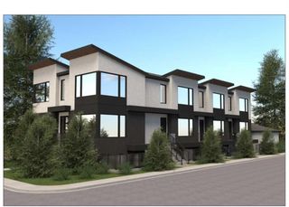 Main Photo: 4204 7 Avenue SW in Calgary: Rosscarrock Row/Townhouse for sale : MLS®# A2100472