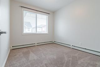 Photo 13: 303 48 Panatella Road NW in Calgary: Panorama Hills Apartment for sale : MLS®# A1231118