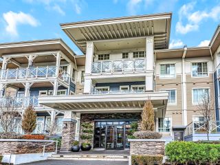 Photo 1: 102 5535 ADMIRAL Way in Delta: Neilsen Grove Condo for sale in "PILOTHOUSE" (Ladner)  : MLS®# R2870015