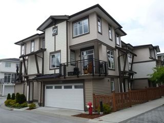 Photo 1: 118 19433 68 Avenue in Surrey: Clayton Townhouse for sale in "THE GROVE" (Cloverdale)  : MLS®# R2309717