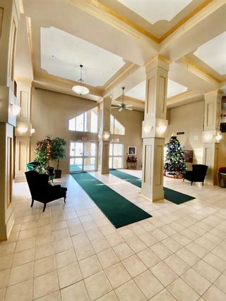 Photo 2: 229 6868 Sierra Morena Boulevard SW in Calgary: Signal Hill Apartment for sale : MLS®# A1165554