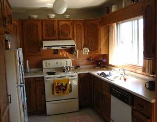 Photo 4: Fully dev Basement....upgraded kitchen