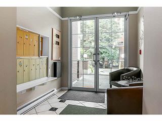Photo 2: 104 130 W 22ND Street in North Vancouver: Central Lonsdale Condo for sale in "THE EMERALD" : MLS®# V1080860