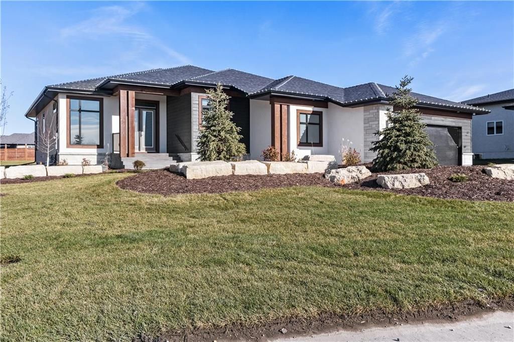 Incredible curb appeal and a great first impression! The wide front drive leads to the oversized garage and beautifully finished exterior on a sunny & fully landscaped lot!