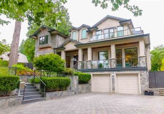 Photo 1: 7451 LAMBETH Drive in Burnaby: Buckingham Heights House for sale (Burnaby South)  : MLS®# R2389583