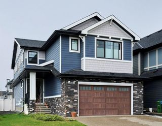 Photo 1: 194 West Grove Way SW in Calgary: West Springs Detached for sale : MLS®# A2053612