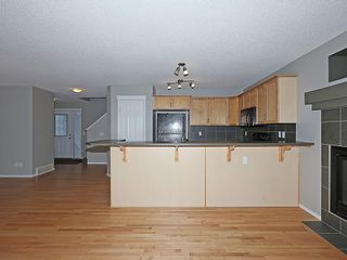 Photo 4: 89 SUNSET Heights: Cochrane House for sale : MLS®# C4177018