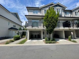 Photo 1: 150 13898 64 Avenue in Surrey: East Newton Townhouse for sale in "Panorama West Coast Living" : MLS®# R2783114