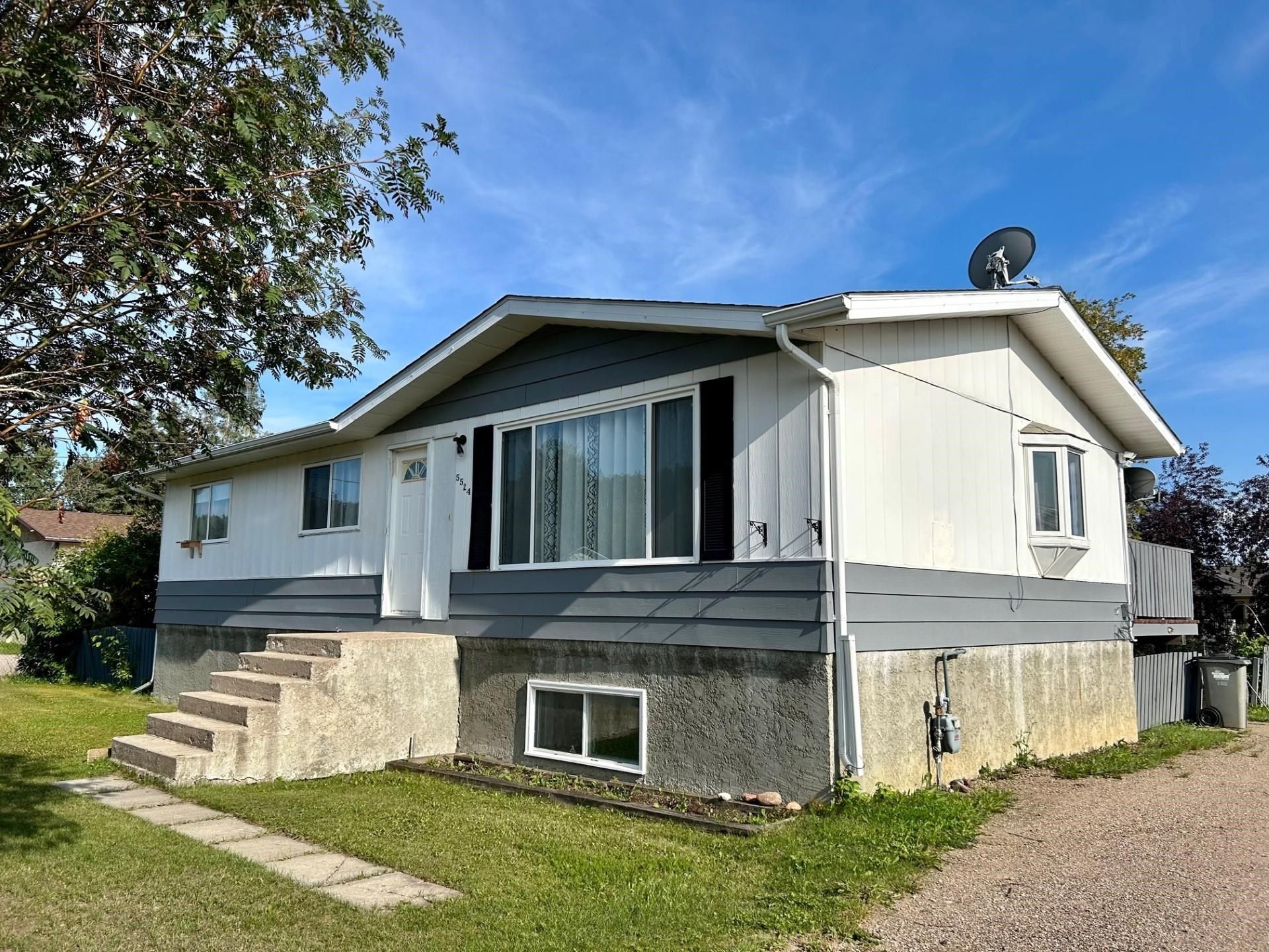 Main Photo: 5524 48 Street in Fort Nelson: Fort Nelson -Town House for sale : MLS®# R2808124