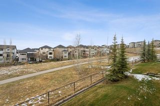 Photo 1: 295 Sunset Point: Cochrane Row/Townhouse for sale : MLS®# A2127381