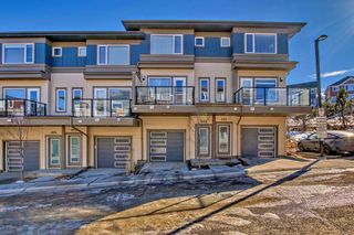Photo 1: 402 501 River Heights Drive: Cochrane Row/Townhouse for sale : MLS®# A2127811