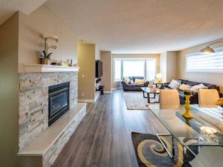 Main Photo: 27 Sandarac Road NW in Calgary: Sandstone Valley Row/Townhouse for sale : MLS®# A2114440