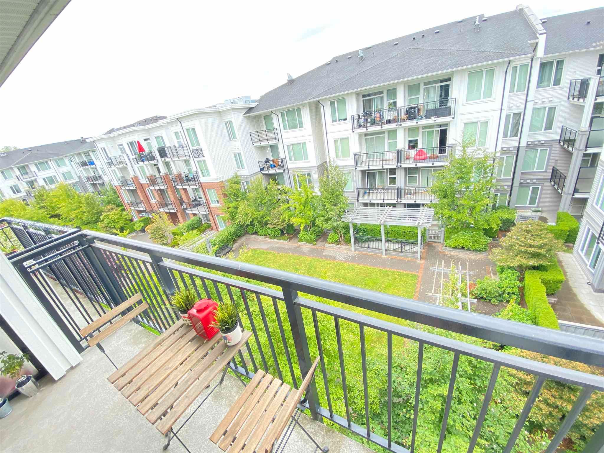 Main Photo: 441 9388 MCKIM Way in Richmond: West Cambie Condo for sale in "MayFair Place" : MLS®# R2595062