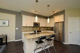 Photo 4: 255 SUNSET Point: Cochrane Row/Townhouse for sale : MLS®# C4224587