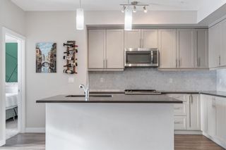 Photo 5: 104 300 Auburn Meadows Manor SE in Calgary: Auburn Bay Apartment for sale : MLS®# A2022411