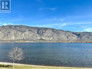Photo 1: 7805 Spartan Drive Unit# 203 in Osoyoos: House for sale : MLS®# 10307184