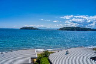 Photo 1: 6500 WILDFLOWER Place in Sechelt: Sechelt District Townhouse for sale in "WAKEFIELD BEACH - 2ND WAVE" (Sunshine Coast)  : MLS®# R2604222