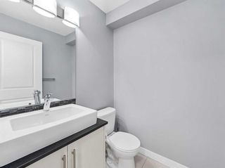 Photo 16: 7 West Coach Manor SW in Calgary: West Springs Row/Townhouse for sale : MLS®# A2129977