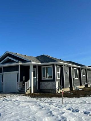 Photo 2: 6301 58A Street: Rocky Mountain House Semi Detached (Half Duplex) for sale : MLS®# A2109083