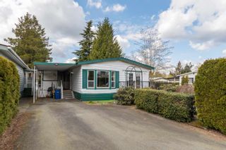 Photo 1: 215 3665 244 Street in Langley: Otter District Manufactured Home for sale in "Langley Grove Estates" : MLS®# R2681287
